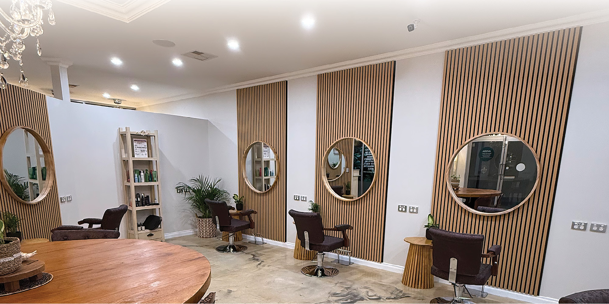 Styling stations with round timber mirrors inside The Source Hairdressing